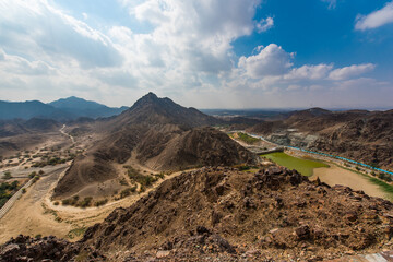 Amazing landscape of  Hajar mountains and mountain lake. Cloudy weather