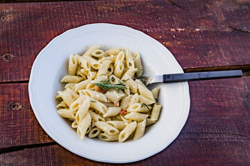 Penne Pasta on Weathered Table