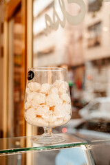 Jar with pastries glass counter street background