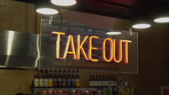 A Cafe Owner Puts A TAKE OUT ONLY Sign . Take Out Or Carry Away Quickly Became The Only Option For Restaurants And Bars During The Coronavirus COVID-19 Pandemic Of 2020.