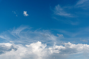 White clouds in the deep blue sky.