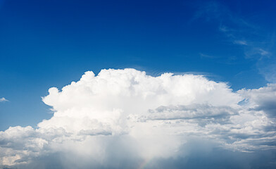 White clouds in the deep blue sky.