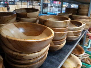 wooden and ceramic bowls on a shop display