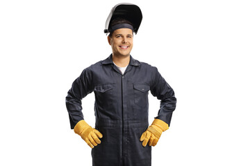 Smiling welder in a uniform with a protective helmet