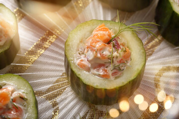 Starter cucumber with salmon in a creamy sauce
