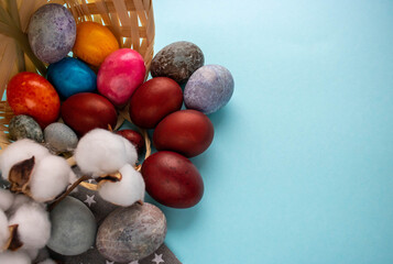 Colorful eggs spilled out of the basket. The Concept Of Easter