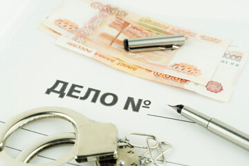 folder and label dealing with handcuffs and money