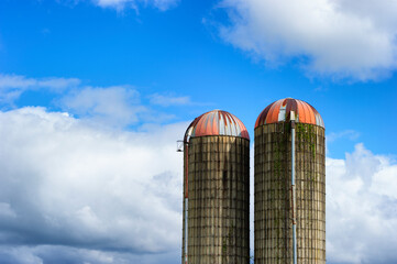 Two Silos against a partically cloudy sky © Dee