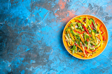 top view tasty vegetable salad inside plate on the blue background color photo food diet health...