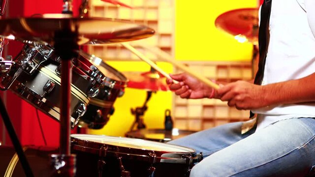 italian artist musician playing drumms during online concert at studio