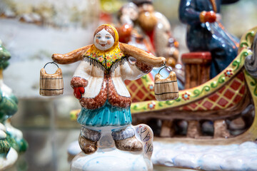 Ceramic figurine of a village woman in traditional Russian clothes