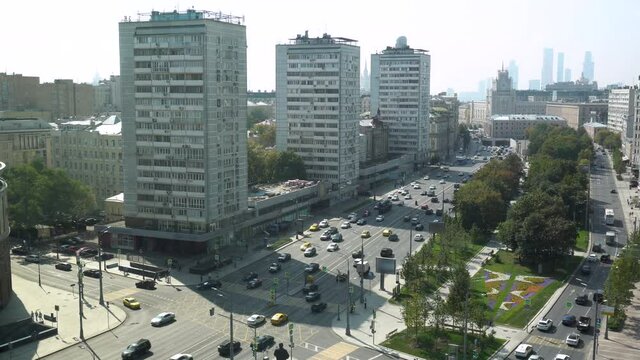 Cars driving on the Moscow road. View from above. Around the building and Alleria