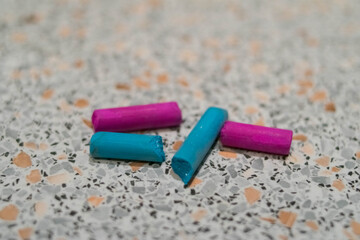 Pastel. Some. Magenta and turquoise. On a light background. Crayons for drawing. Materials for artists.