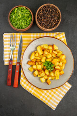 top view tasty fried potatoes inside plate on dark-grey background color photo cuisine food