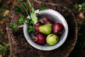 Red pear on wooden background