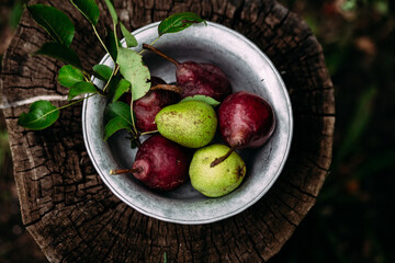 Red pear on wooden background