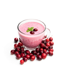 Pink smoothie with cranberry in glass cup on black stone background
