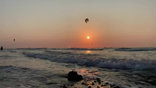kitesurfing at sunset on the mediterranean sea. Netanya  Israel