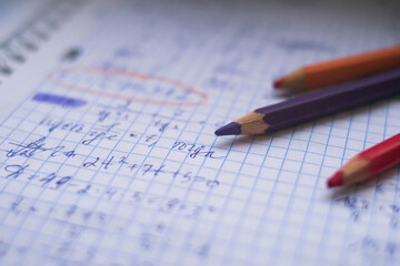 Office. Study. Colored pencils on paper. Formula sheet. Mathematics. Notebook on rings.