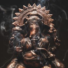 statue of hindu god ganesha ganapati in smoke