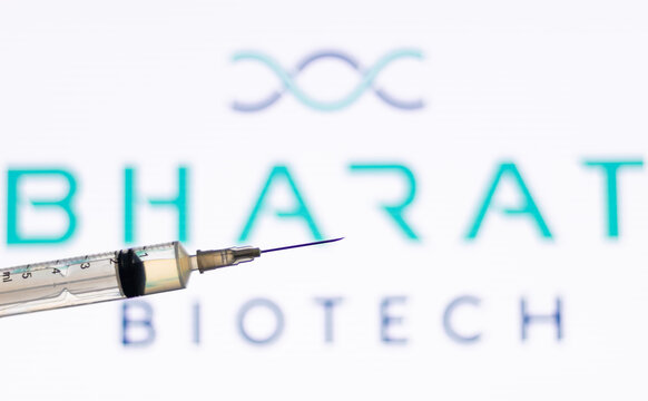 Closeup Of Syringe Injection Full Of Vaccine Against Bharat Biotech Logo.