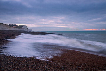 High tide at dawn on Saltdean beach near Brighton East Sussex south east England
