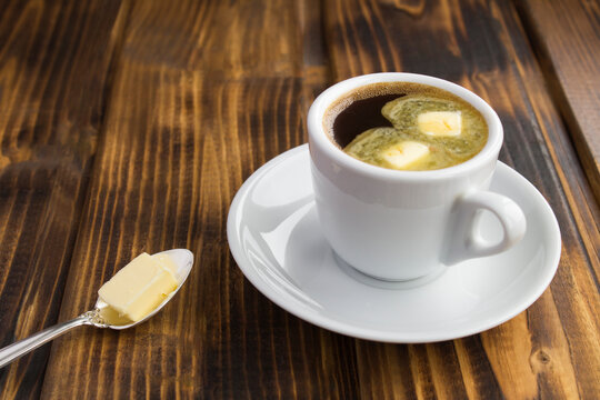 Bulletproof coffee keto diet energy drink on the wooden background