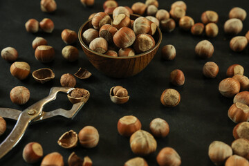 Hazelnuts on wooden backdrop. heap or stack of hazelnuts. healty food