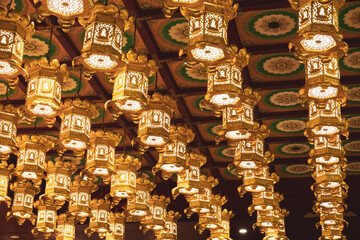 lanterns hanging from the roof of the temple