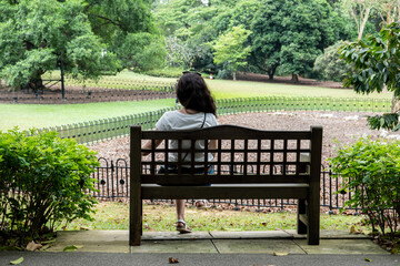 sitting on the bench at the park