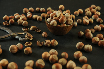 Hazelnuts on wooden backdrop. heap or stack of hazelnuts. healty food