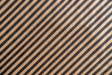 Black pattern stripe on brown paper background.
Diagonal landscape black pattern stripe on recycled  paper texture