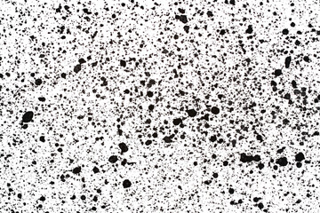 Splashes of black paint on white paper. Abstract background.