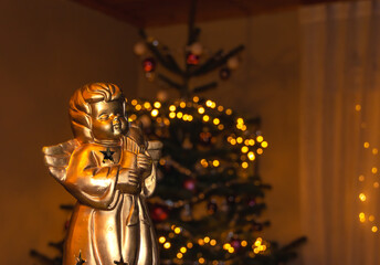 Festive Christmas decoration with angel and blurred lights in the background