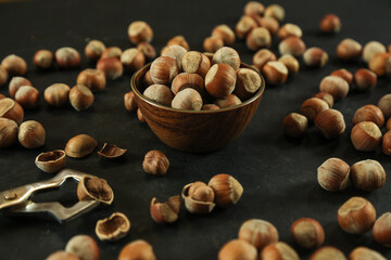 Hazelnuts on wooden backdrop. heap or stack of hazelnuts. healty food