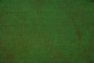 Aged green canvas through natural dyes. Copy space. Top view.