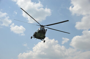 Naklejka na ściany i meble Russian military helicopter MI-8 in the sky