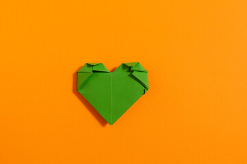 Origami hearts made with colored paper for congratulations on Valentine's Day for couples in love,...
