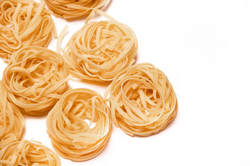 Macaroni nest isolate . Macaroni on a white background. Article about nests pasta dishes.