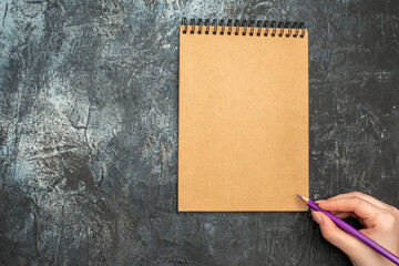 top view simple notepad with pencil on grey background photo copybook school pencil