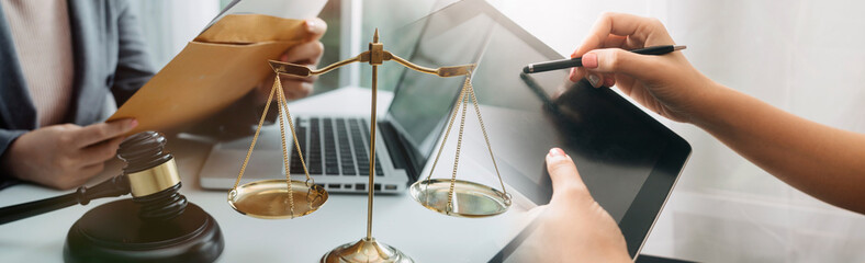 justice and law concept.Male judge in a courtroom on wooden table and Counselor or Male lawyer...