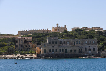 The medieval limestone city of Valletta with its main symbols - bell tower of St Paul Pro-Cathedral and large dome of Carmelite church, Malta