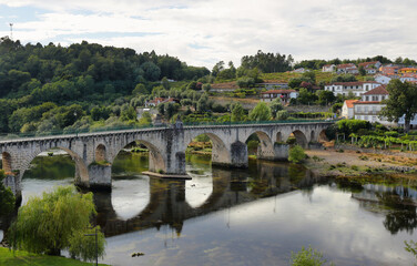Fototapeta na wymiar Ancient roman bridge of Ponte da Barca in the north of Portugal