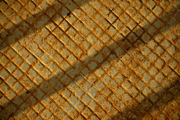 Rusty yellow metal for background or texture with shadows, depth, color and room for copy