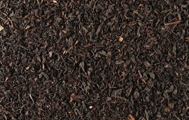 Black tea leaves background and texture