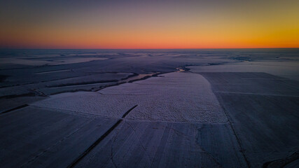 beautiful sunset in a winter frosty field