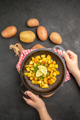 top view fried potatoes inside pan with fresh potatoes on dark background dish cuisine meal color dinner