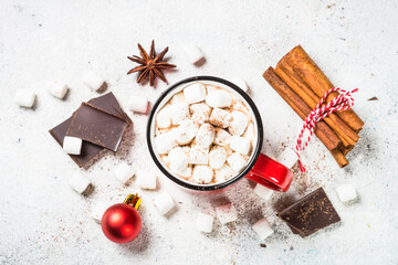 Christmas drink. Hot chocolate with marshmallow and gingerbread cookies with holiday decorations at white table. Top view with copy space.