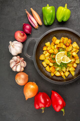 top view fried potatoes inside pan with different vegetables on dark background cuisine meal food color pepper