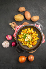 top view fried potatoes inside pan with fresh vegetables on a dark background dish cuisine meal food color dinner